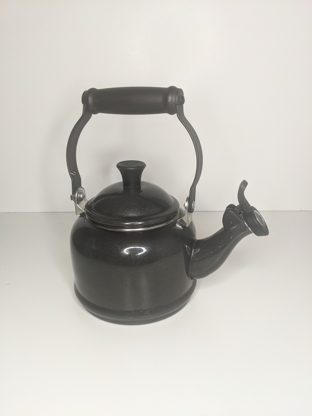 Le Creuset Black Whistling Stovetop Tea Kettle with Foldable Handle